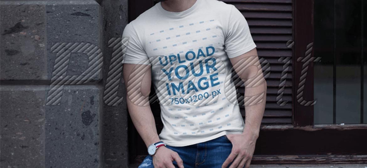 Download Buff-man-wearing-a-t-shirt-mockup-while-lying-against-a ...